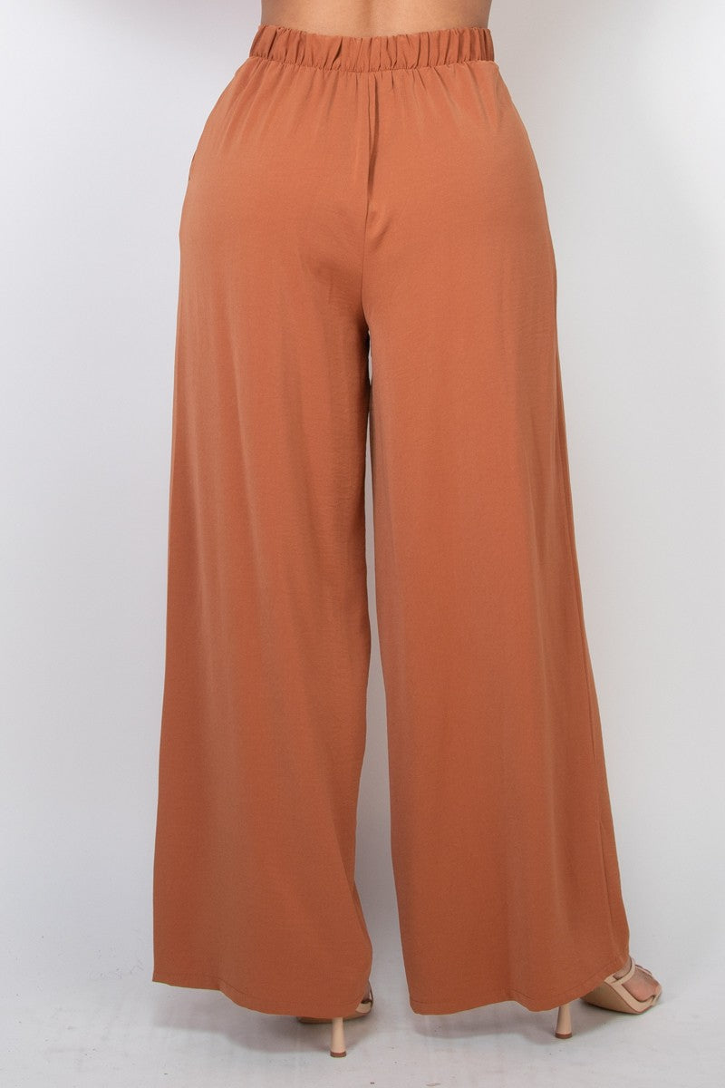 Pantalones amplios de tiro alto con pliegues