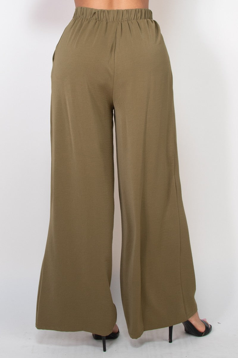 Pantalones amplios de tiro alto con pliegues