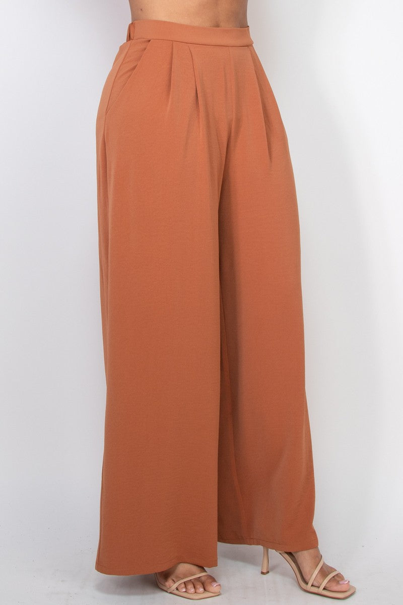 Pantalones amplios de tiro alto con pliegues