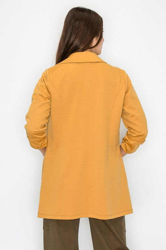 Open shirred quarter sleeve jacket