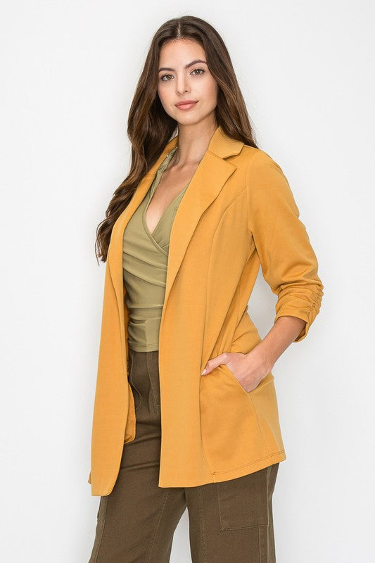 Open shirred quarter sleeve jacket